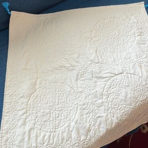 White quilted wall or center piece.